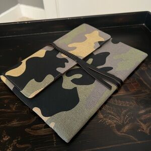 Stella & Dot Camouflage Clutch with Black tassel detail.